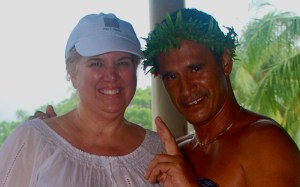 Can't puplish the fullsize version of the photo.  I am totally soaked by the rain.  But that didn't stop me from taking a photo with a cute Tahitian bellhop.  When not being photographed, I wore my backpack in front to cover the white-now sheer-white top.