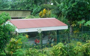 There are no cemetaries on Bora Bora.  A loved one's tomb is erected on the family's property, sometimes filling the entire yard. ©Jean Janssen