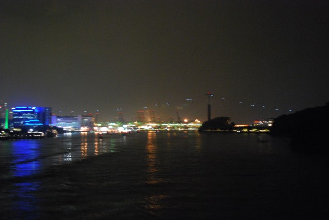Our departure from Singapore.  The lit cable cars dot the skyline like fireflies. ©Jean Janssen