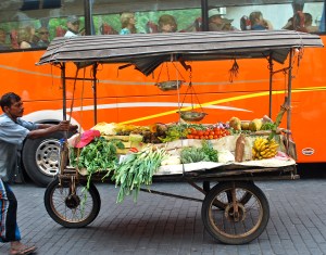 This is where you get those fresh fruits and vegetables.  Love the twist with the bus in the background. ©Jean Janssen