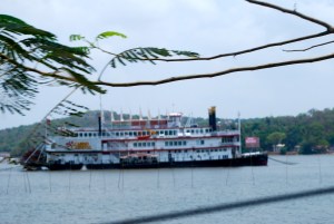 Riverboat Casino in Panaji, Goa, India.  The bamboo sticks in front are used to attach a net for fishing. ©Jean Janssen