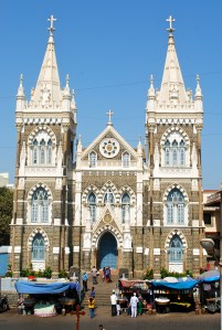 Mount Mary Basilica, Bandra, India.  People of all faiths come here on pilgrimage to seek help or give thanks for it.  In front, vendors sell garlands of flowers and candles to give as an offering. ©Jean Janssen