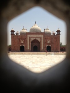 View of Taj Mahal guesthouse as seen through the lattice work window coverings in the Taj Mahal. ©Jean Janssen