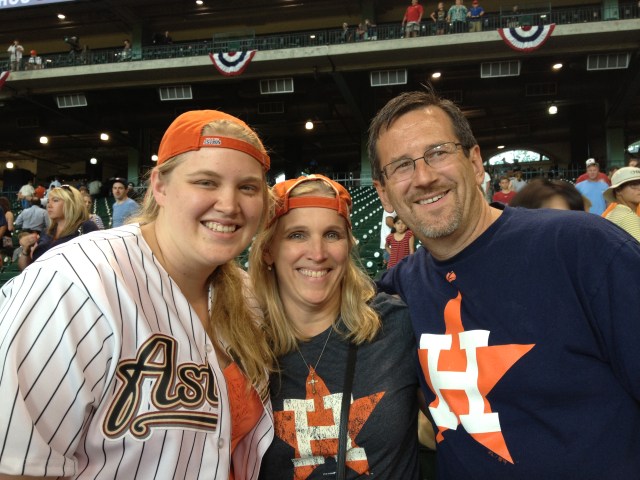 Maggie, Emma, and Dudley sport Astros gear for the game. ©Jean Janssen