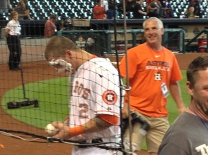 A class act.  Astro Brandon Barnes continues to sign the fans' baseballs after a pie in the face. ©Jean Janssen