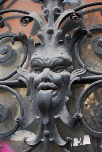 Ugly or scary figures were often found on the outside of house to protect against evil spirits.  These are on the doors of one of the unrenovated buildings in the old city of Bratislava. ©Jean Janssen