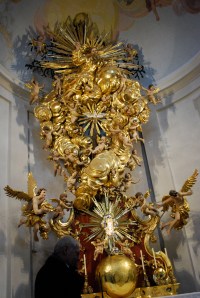 Altar at the Church at Christkindl, Austria.  It is supported by the tree with the figure of baby Jesus imbedded in it (seen near the bottom). ©Jean Janssen