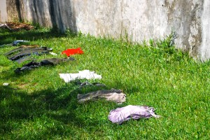 Drying clothes Madagascar style.  Saw this all over the country-drying clothes on the ground.  The fort still houses military and this picture was taken at the fort. ©Jean Janssen