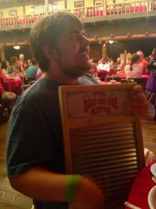 Like Rocky, you too can be part of the musical entertainment at the Hoop Dee Doo Musical Revue at Pioneer Hall at Fort Wilderness Campground, WDW.  Dinner show starts with all the wine, beer, and sangria you care to drink.  There is fried chicken and other comfort foods (or other foods on special request).  The six performers and two musicians (plus you on a washboard) perform intermittently through the two-hour evening.  the show has run for 41 years and is still really hard to get into.  The best way to reach Pioneer Hall is to take a bus to the Magic Kingdom and then the boat to Fort Wilderness.  Pioneer Hall is a short walk from the boat dock. ©Jean Janssen 