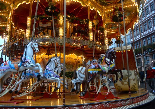 Traditional Carousel with a single dark horse, Christmas Market, Frankfurt, Germany ©Jean Janssen