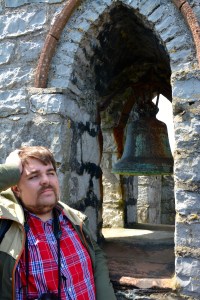 Rocky taking a break at the top of Castle Rushen, Castletown, Isle of Man.  The bell is engraved "Earl of Derby 1729" ©Jean Janssen
