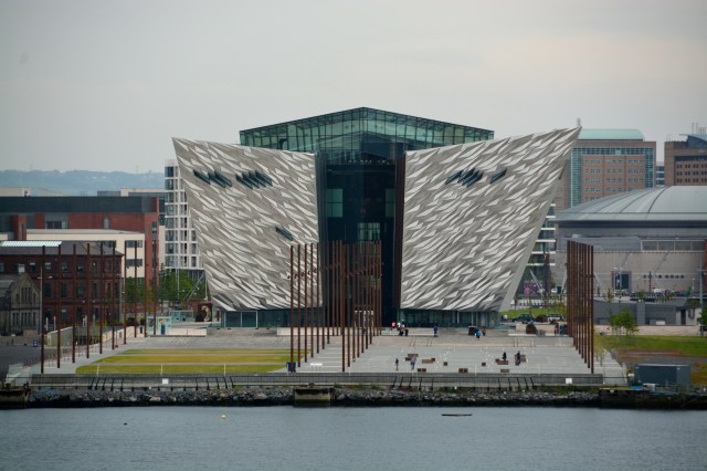 The Titanic Museum, Belfast, Northern Ireland.  The metal poles in front represent the actual size of Titanic.  The ship was built in these docklands.  The perspective of this photo is from our ship, the Azamara Quest, at berth in the same docklands. ©Jean Janssen