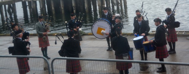 Bagpipe band outside our cabin window, Invergordon, Scotland ©Jean Janssen