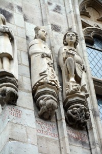 Detail on some of the Town Hall statutes, Cologne, Germany  If you are charged with raising taxes, you might not be the most popular; check out the extra detail added to the "bottom" of the middle statute. ©Jean Janssen