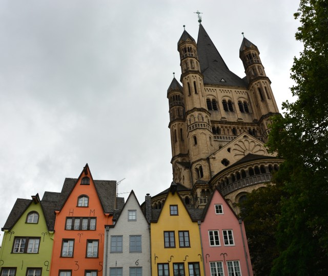 As viewed from our pub stop along the waterfront with Great Saint Martin Church in the background and reconstructed period building in the front. ©Jean Janssen